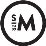 A solid black circle set against a white background.