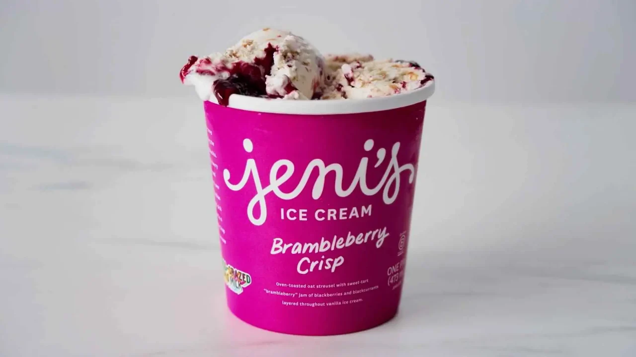 A purple container of Jeni's Ice Cream Brambleberry Crisp flavor, perfect for B2C marketing, against a plain white background.